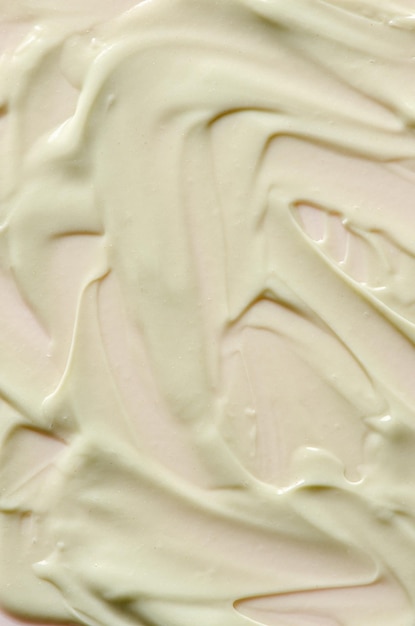 A sample of moisturizer on a pink background Cosmetic product for the skin