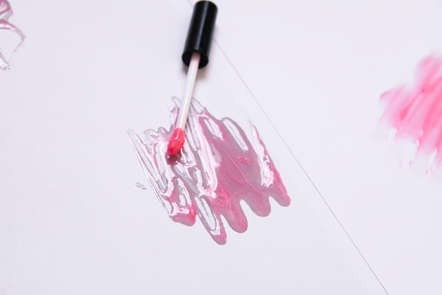 Sample of the pink lip gloss on a white background.