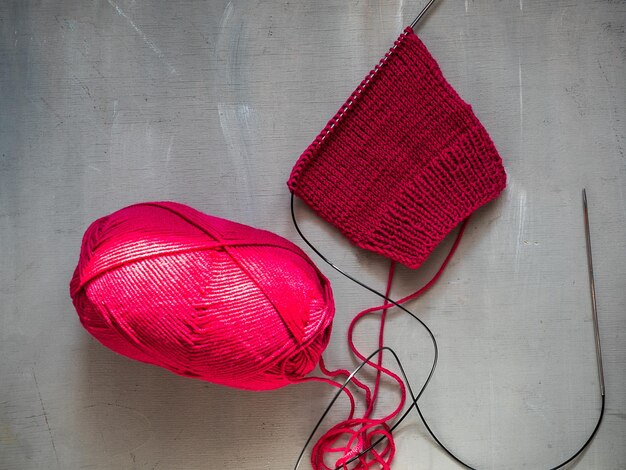 Photo sample in stockinette stitch from sixth yarn in magenta color for hand knitting