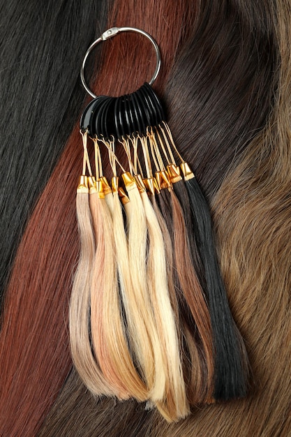 Samples of female hair on hair background