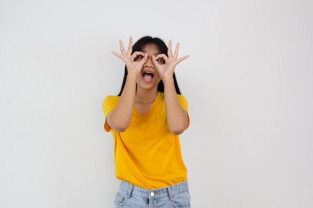 Samrt young girl wear yellow shirt and Jean smilling on white background