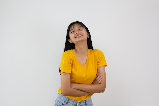 Samrt young girl wear yellow shirt and Jean smilling on white background