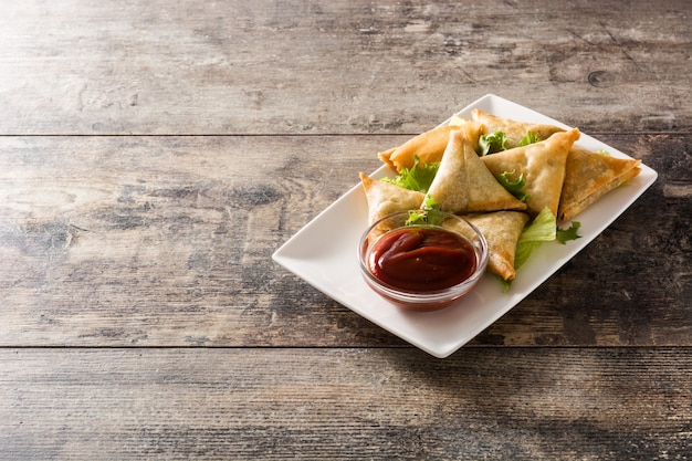 Samsa or samosas with meat and vegetables