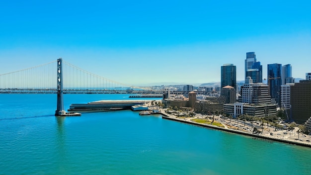 Photo san diego california skyline at nightbridge over river in city