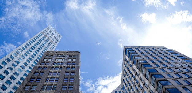 San Francisco, USA. Modern tower building, skyscrapers in financial district with clouds on sunny day