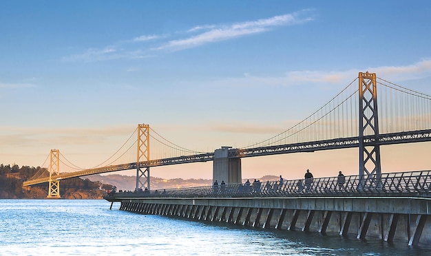 San franciscooakland bay bridge against blue sky