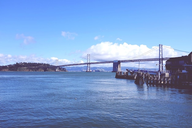San franciscooakland bay bridge over sea against sky