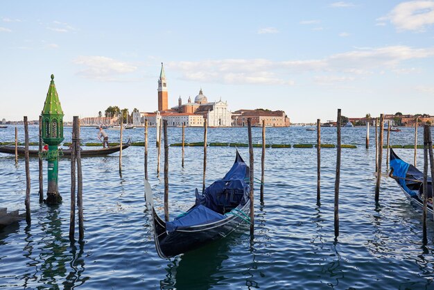 Premium Photo | San giorgio maggiore island basilica and gondola boats ...