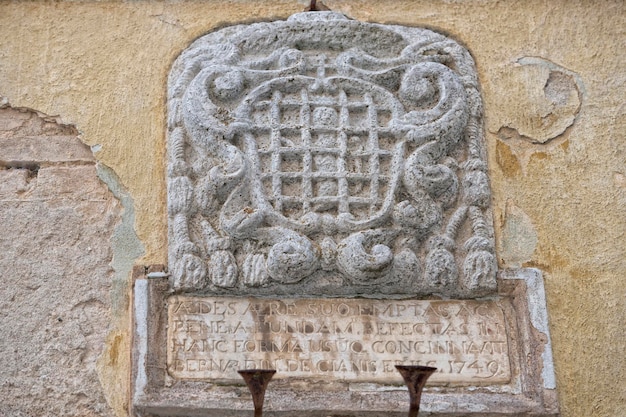 San quirico medieval houses stone wall vatican bas relief