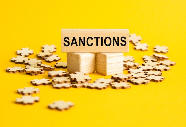 Sanctions Note on a cubes Cubes on a yellow background