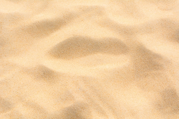 Песок на пляже в качестве фона.