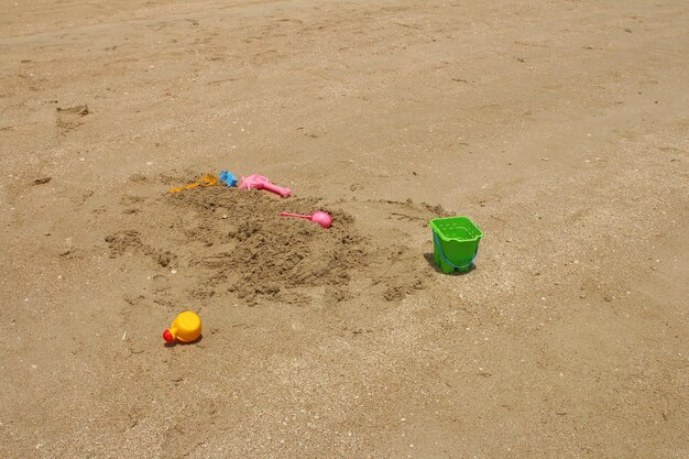 sand castles and buckets on the beach in the sand