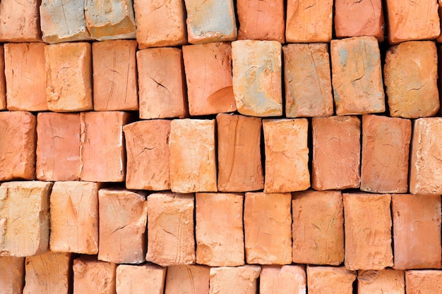 Sand clay bricks are stacked as a background to form a strong, stable wall.