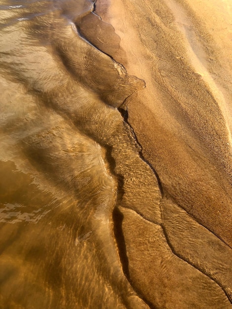 Sand and clear river water