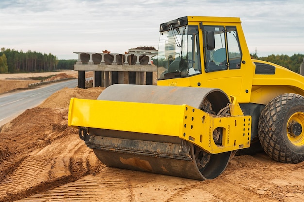 Sand compactor on pile of sand