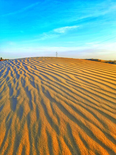 Sand dunes and cloudy sky in desert of algeria