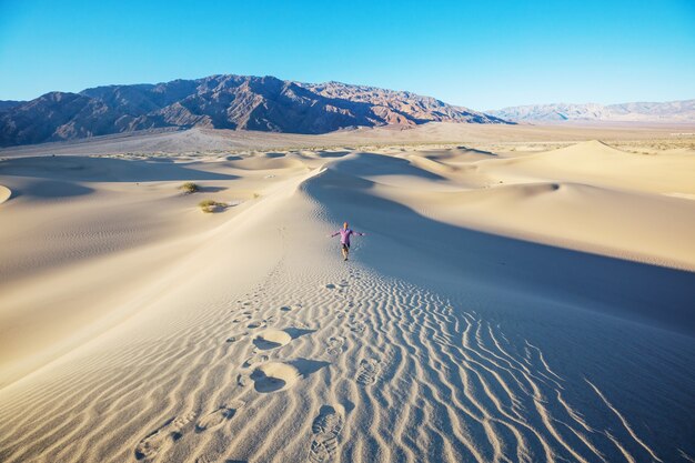 Sand dunes in Death Valley National Park, California, USA. Living coral toned.