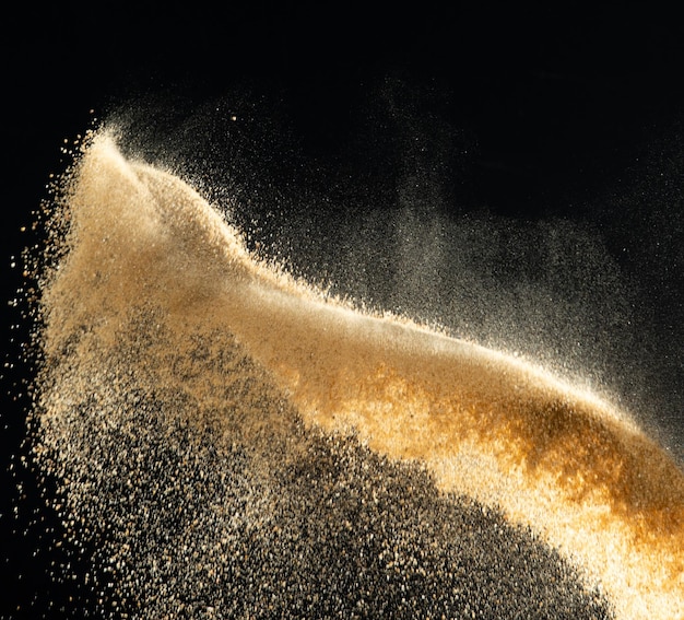 Sand flying explosion Golden sand wave explode Abstract sands cloud fly Yellow colored sand