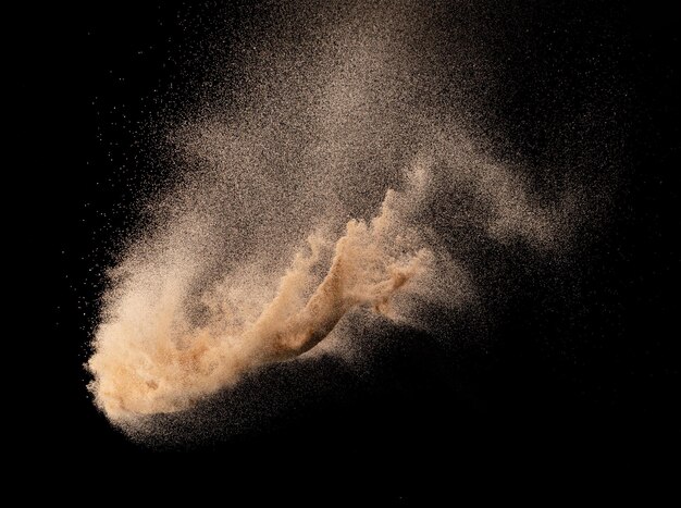 Sand flying explosion Golden sand wave explode Abstract sands cloud fly Yellow colored sand