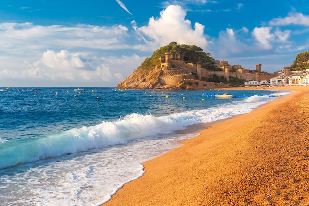 Sand gran platja beach and fortress in the morning in tossa de mar on costa brava catalunya spain