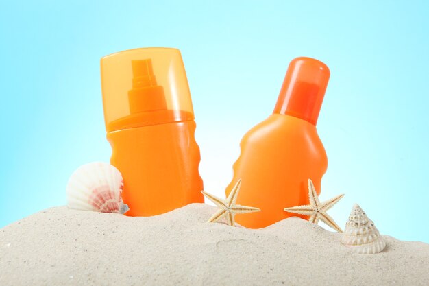 Photo sand shells starfish and sun protection products