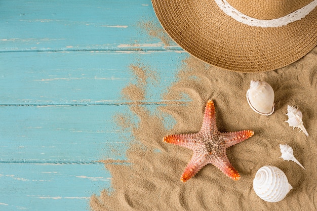 Sand and shells on the wooden floor of the blue,summer concept