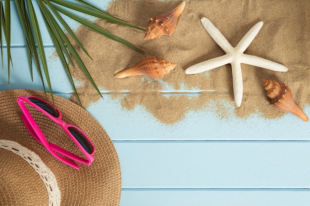 Sand and shells on the wooden floor of the blue,summer concept