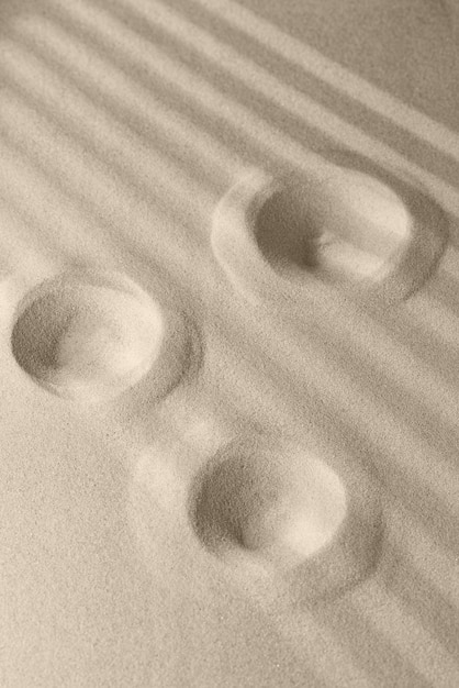 Photo sand surface texture with smooth lines and shadows