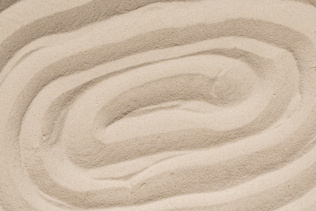 砂のテクスチャのクローズアップ。砂の背景。上面図。