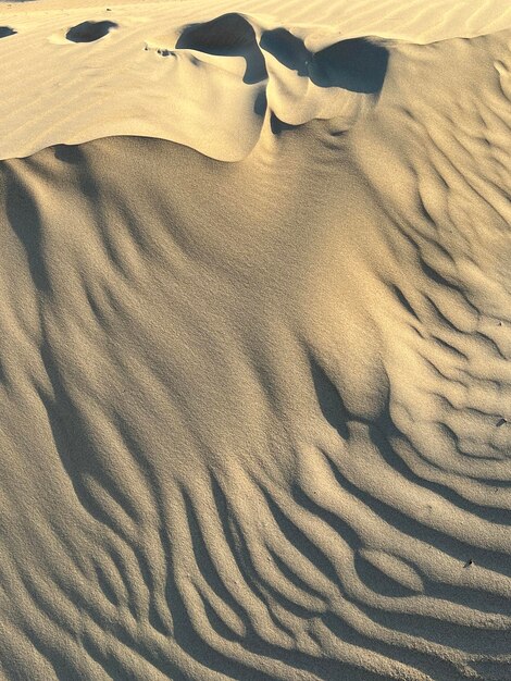 Foto trama di sabbia spiaggia sabbiosa per lo sfondo vista dall'alto