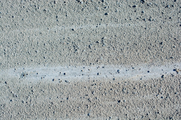 Песок текстурирован как абстрактный гранж-фон