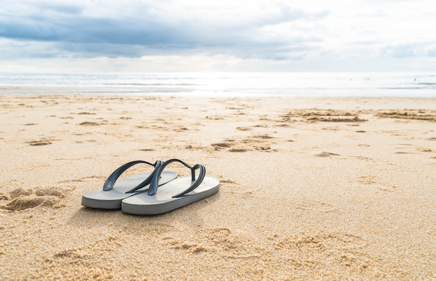 sandals on the sandy sea coast