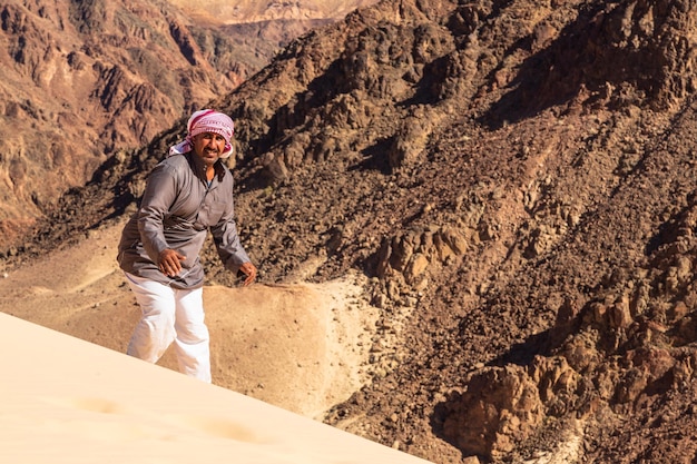 Sandboarding in Sinai desert, big dune in Sinai, Egypt