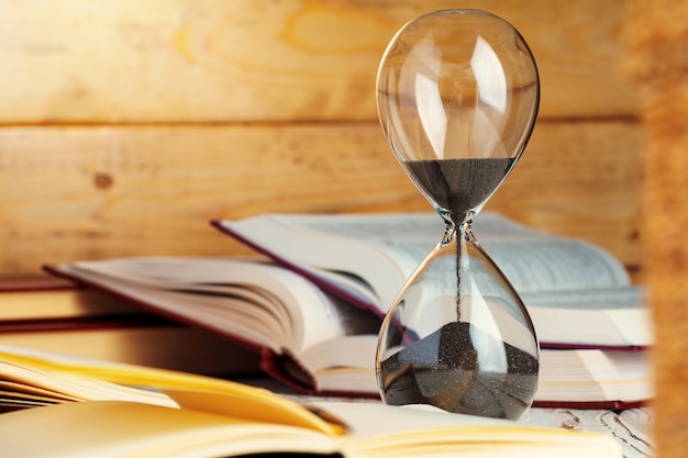 Photo sandglass clock close up on a table