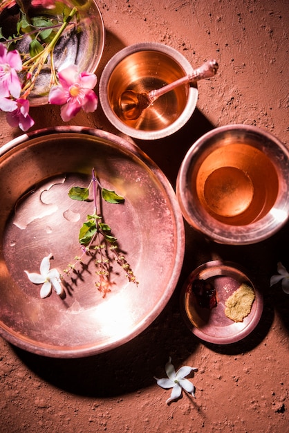 Sandhya Vandanam Kriya - Copper Utensils like Kalash, Glass, Spoon & Plate used by Bramhins after sacred thread ceremony or upanayanam while praying with tulsi, flowers & water