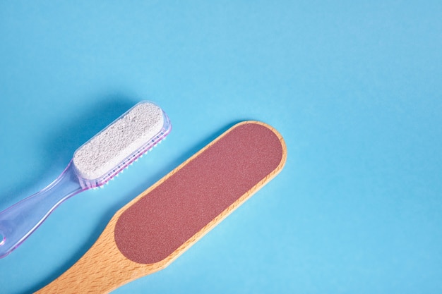 Sandpaper for feet with wooden handle and plastic pumice stone with foot brush