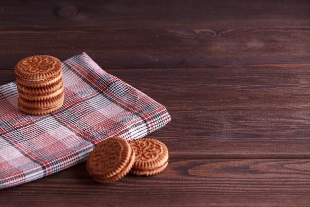 Sandwich biscuits, Cream biscuits, Cookies with cream filling on wooden table