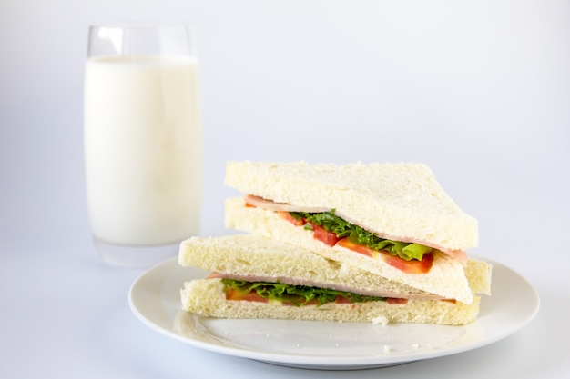 Sandwich and milk glass.