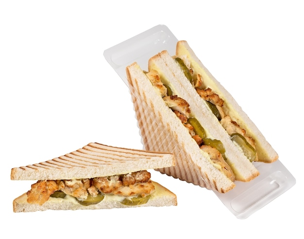 Sandwich in a plastic box isolated on a white surface.