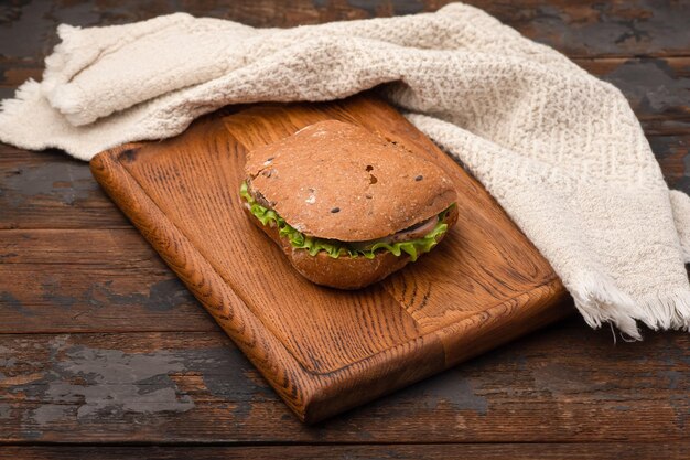 Sandwich sandwich with different fillings on a wooden background