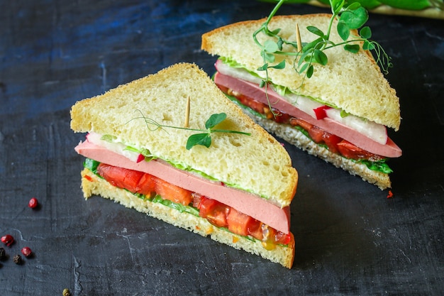 Sandwich sausage, vegetables, tamato, lettuce