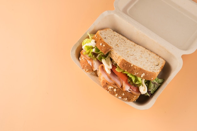 Sandwich of tomato, lettuce and smoked turkey