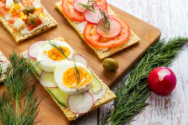 Sandwich with boiled chicken egg on diet bread in a close-up