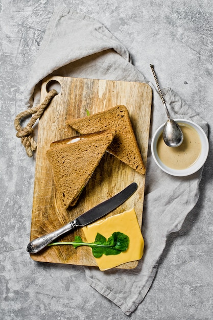 Sandwich with cheese turn, black bread, Turkey meat. 