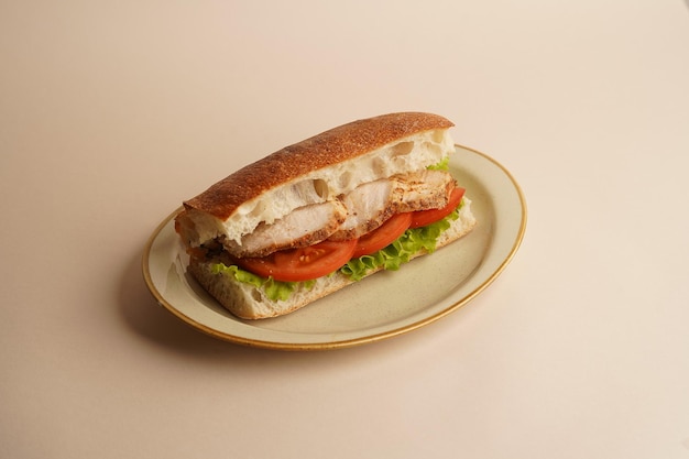 Sandwich with chicken breast lettuce and tomato