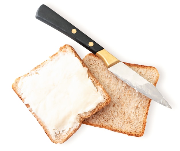 Sandwich with cream cheese and knife close-up on a white isolated background. The view from top