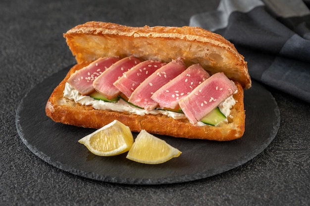 Sandwich with cream cheese, tuna and sesame seeds