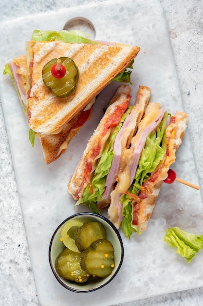 Sandwich with ham cheese tomatoes lettuce and toasted bread