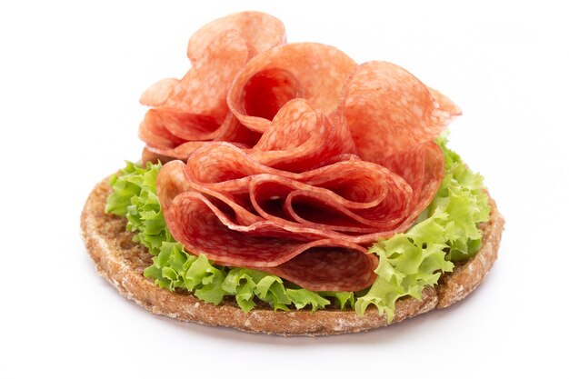 Sandwich with ham sausage on white background