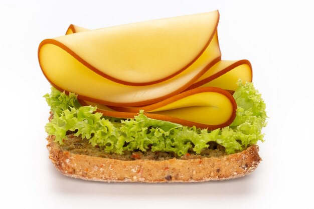 Sandwich with lettuce, cheese on white background.